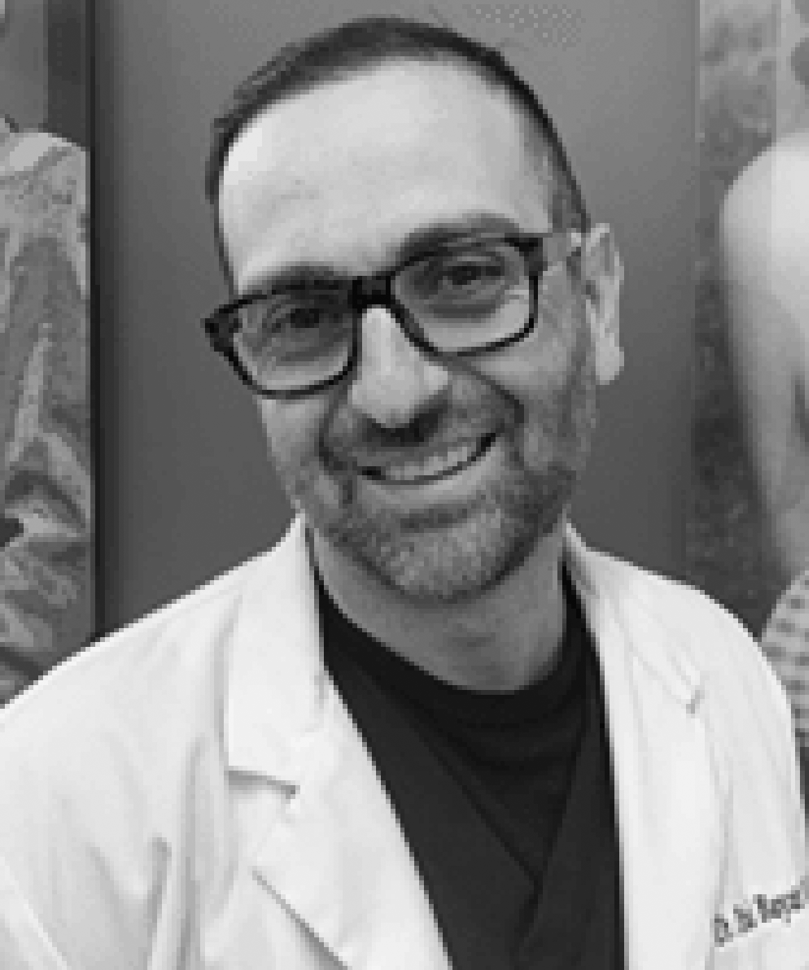 Smiling Male Dentist in Glasses